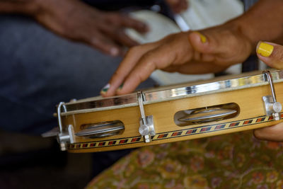 Tambourine being played by a ritimist during a samba performance in brazilian carnival