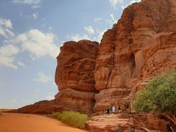 View of rock formation against cloudy sky