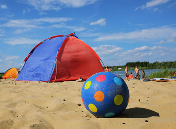 Tent on beach against sky