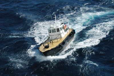 High angle view of boat sailing in sea