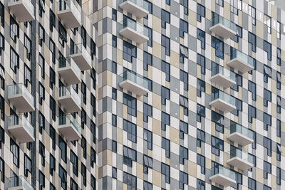 Low angle view of modern apartment building in city