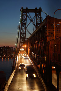 Illuminated bridge at night