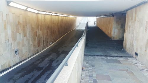 Empty footpath amidst buildings in subway