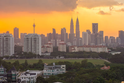 View of cityscape against sky during sunset