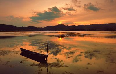 Scenic view of sunset over lake