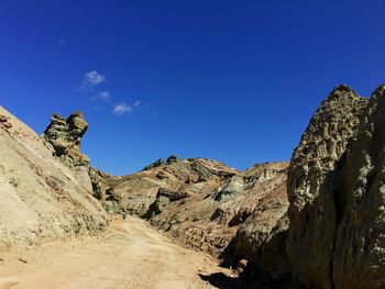 Panoramic view of mountains against clear blue sky