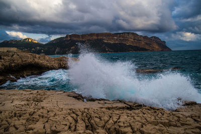 Scenic view of sea shore against sky