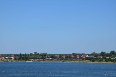 Scenic view of sea against clear blue sky