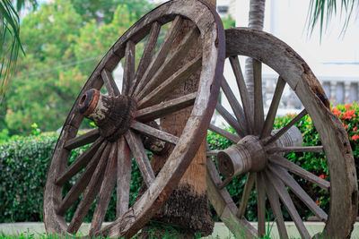 Low angle view of abandoned wheel on field