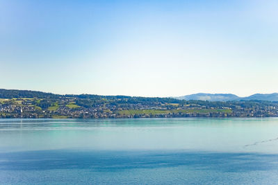 Scenic view of sea against clear blue sky