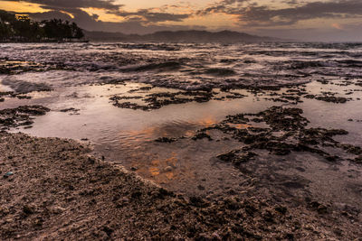 Scenic view of sea against sky at sunset