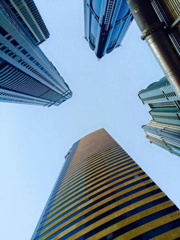 architecture, building exterior, built structure, low angle view, skyscraper, modern, tall - high, tower, office building, city, clear sky, tall, building, blue, directly below, city life, day, financial district, outdoors, glass - material