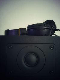 Close-up of camera over black background