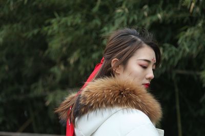 Beautiful woman in warm clothes during winter