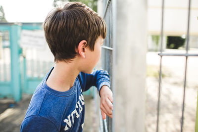 Portrait of boy standing outdoors