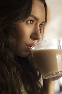 Close-up of woman holding wineglass