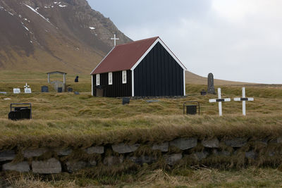 House on field against sky