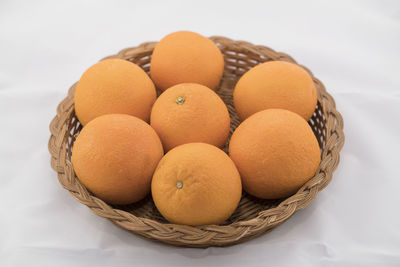 High angle view of fruits in basket on table