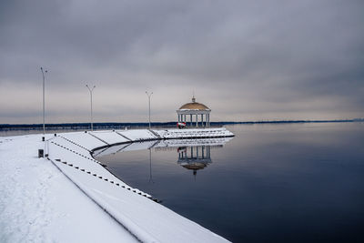 Ship in winter against sky