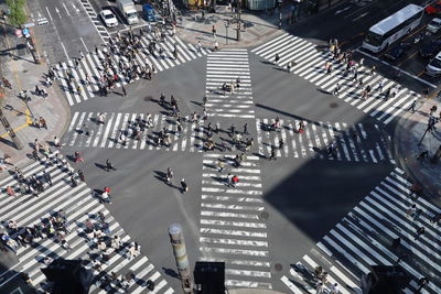 High angle view of people crossing road