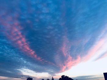 Low angle view of dramatic sky during sunset