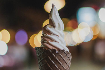 Close-up of hand holding illuminated lighting equipment