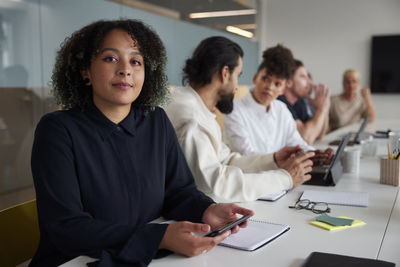 Portrait of businesswoman working at office