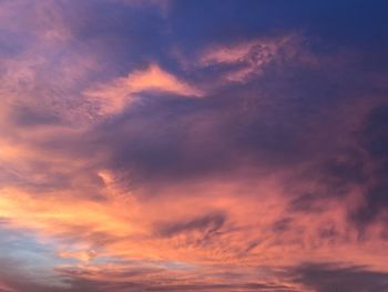 Low angle view of dramatic sky during sunset