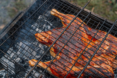 Close-up of meat on barbecue grill