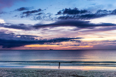 Scenic view of sea against dramatic sky