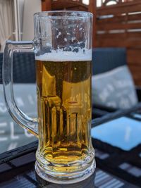 Close-up of beer glass on table