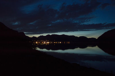 Scenic view of mountains against sky at dusk