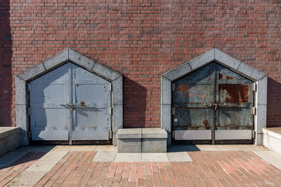 Open door of brick wall