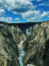 Scenic view of mountain against sky. lower falls, yellowstone 