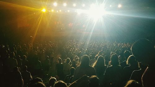 Rear view of people enjoying in concert