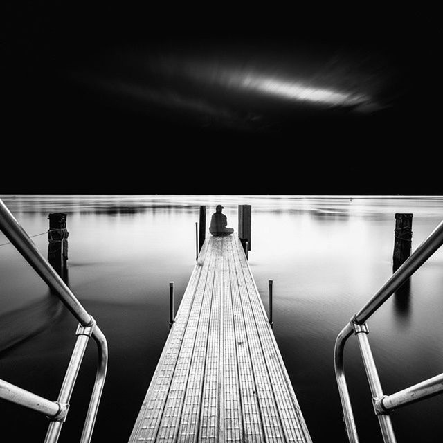 railing, built structure, architecture, illuminated, indoors, the way forward, modern, diminishing perspective, steps and staircases, steps, night, reflection, escalator, water, low angle view, lighting equipment, staircase, no people, metal, sky