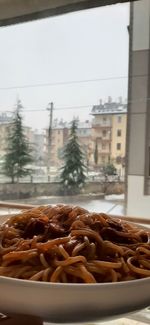 Close-up of food on table against window