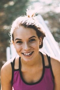 Close-up portrait of a smiling young woman