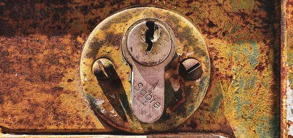 Close-up of old rusty door knocker