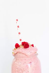 Close-up of pastry on white background