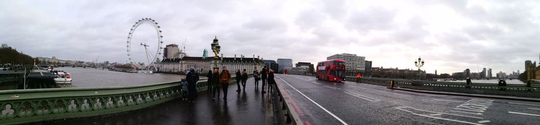 Panoramic view of train against sky in city