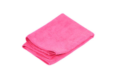 Close-up of pink paper over white background