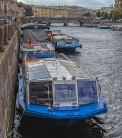 High angle view of boats moored at harbor