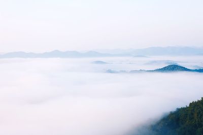 Scenic view of cloudscape and mountains against sky