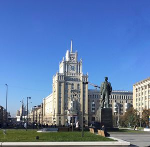 Buildings against clear blue sky