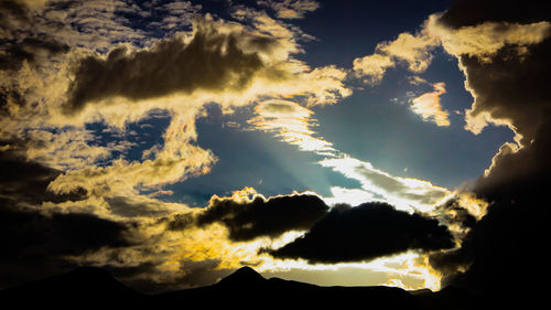 Low angle view of dramatic sky during sunset