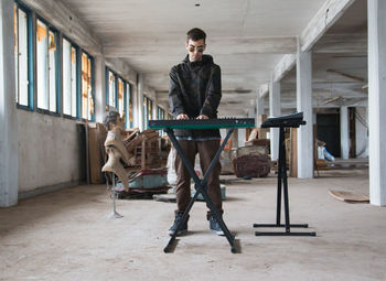 Portrait of young man playing music