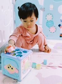 Portrait of boy playing with toy blocks