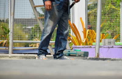 Low section of man working at construction site