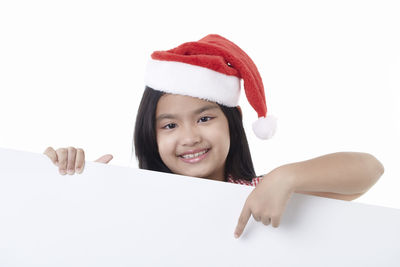 Portrait of a smiling young woman over white background
